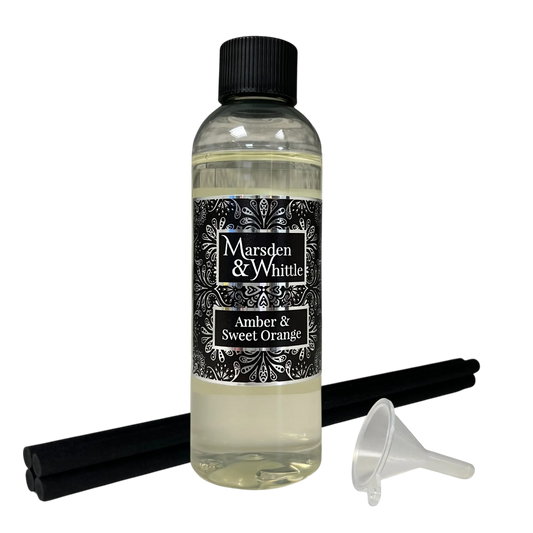 Amber & Sweet Orange Reed Diffuser Refill with 4 black reeds and a small plastic funnel