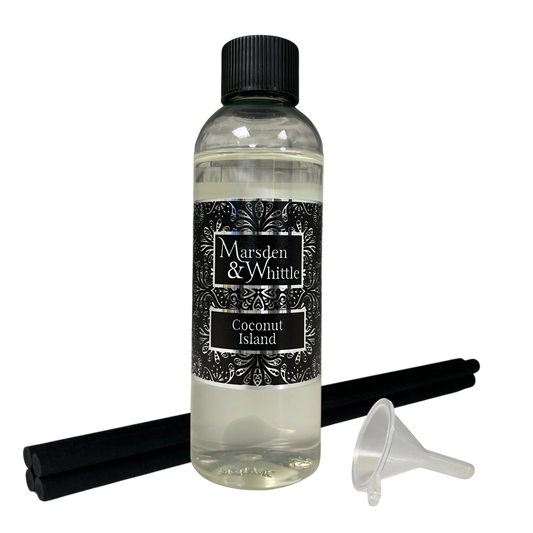 Coconut Island Reed Diffuser Refill with 4 black reeds and a small plastic funnel