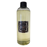 A 500ml Marsden & Whittle Reed Diffuser Refill bottle containing AMber & Sweet Orange fragrance oil with a black screw cap top.