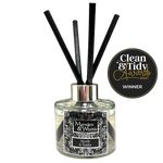 Marsden & Whittle reed diffuser - a glass bottle with 4 black reeds and Clean & Tidy Awards badge