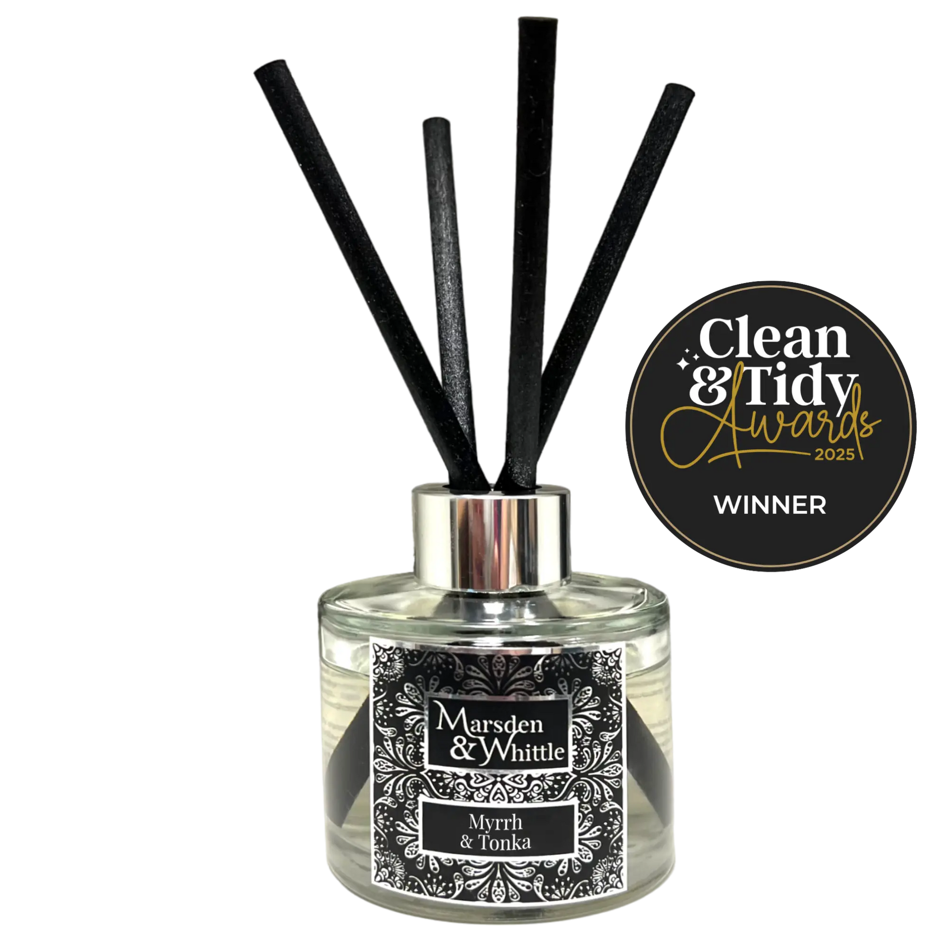 Marsden & Whittle reed diffuser - a glass bottle with 4 black reeds and Clean & Tidy Awards badge