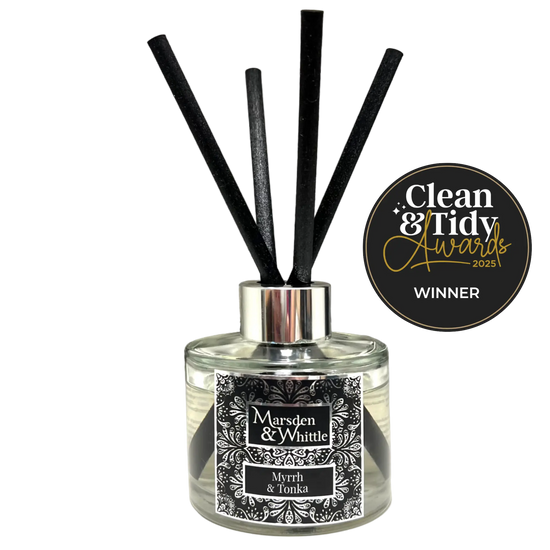 Marsden & Whittle reed diffuser - a glass bottle with 4 black reeds and Clean & Tidy Awards badge