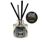 Marsden & Whittle reed diffuser - a glass bottle with 4 black reeds and Clean & Tidy Awards badge