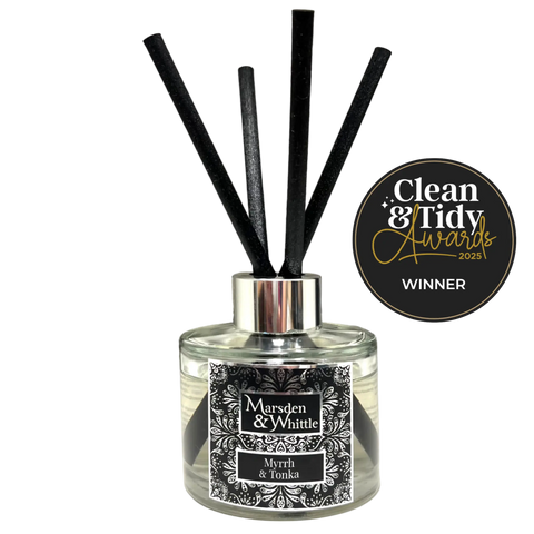 Marsden & Whittle reed diffuser - a glass bottle with 4 black reeds and Clean & Tidy Awards badge