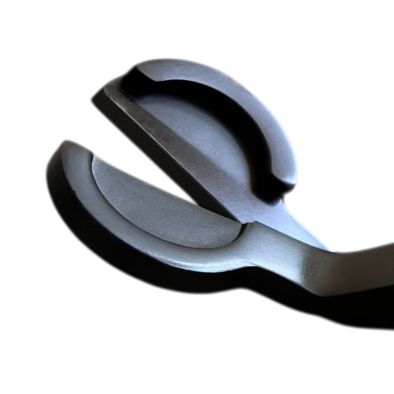 A close up shot showing the opening and blades of a set of black candle wick trimmers.