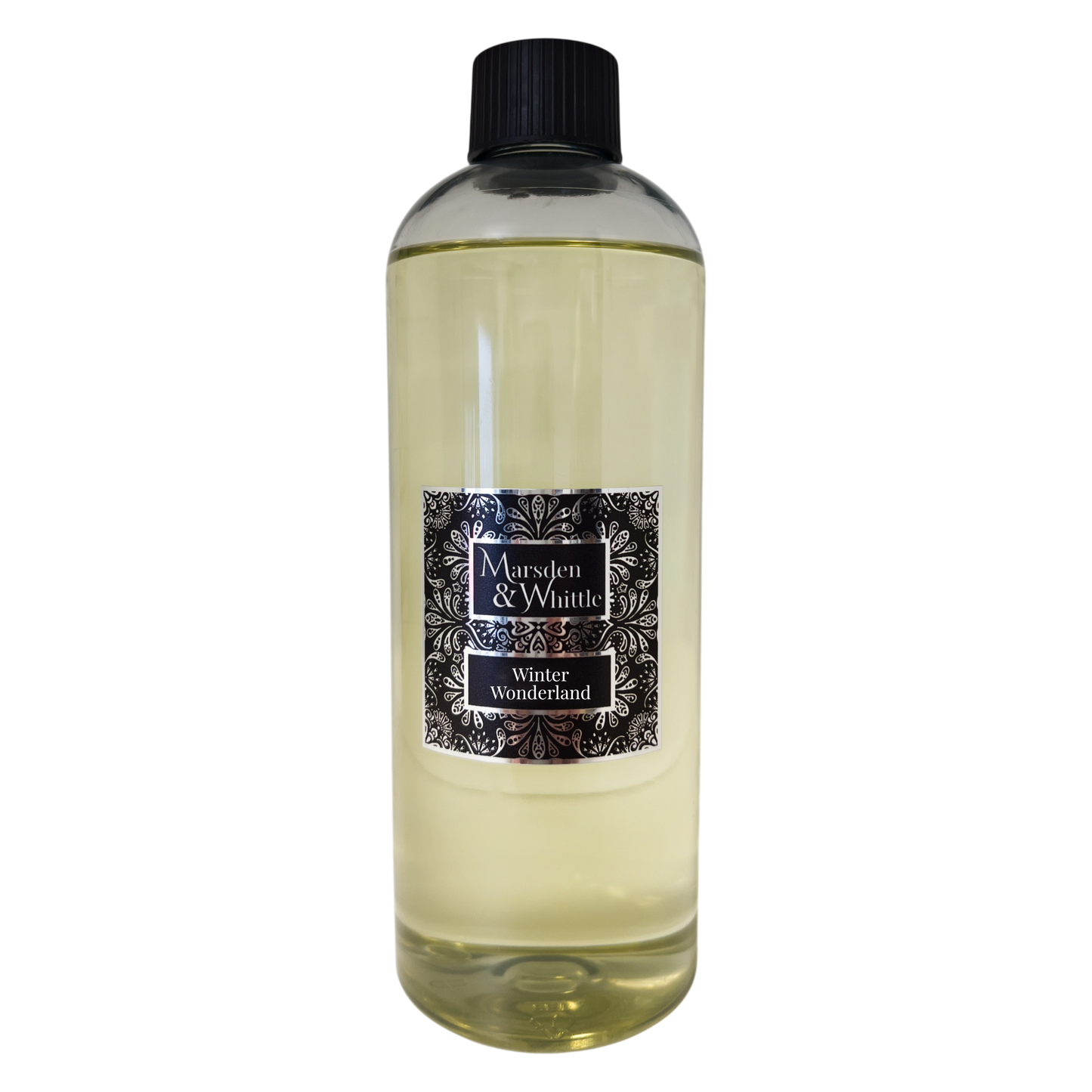 A 500ml Marsden & Whittle Reed Diffuser Refill bottle containing Winter Wonderland fragrance oil with a black screw cap top.