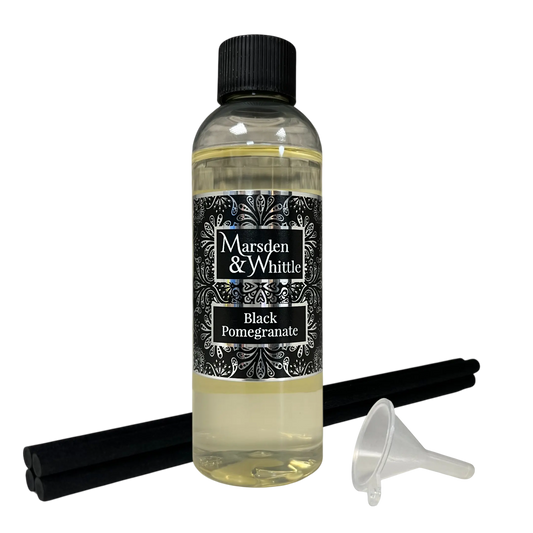 Black Pomegranate Reed Diffuser Refill with 4 black reeds and a small plastic funnel
