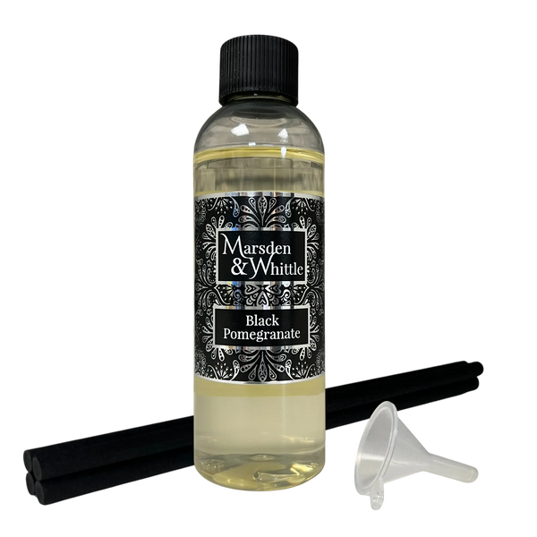 Black Pomegranate Reed Diffuser Refill with 4 black reeds and a small plastic funnel