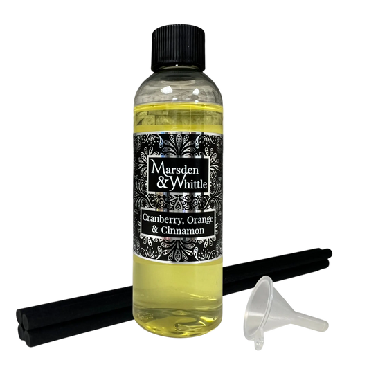 Cranberry, Orange & Cinnamon Reed Diffuser Refill with 4 black reeds and a small plastic funnel