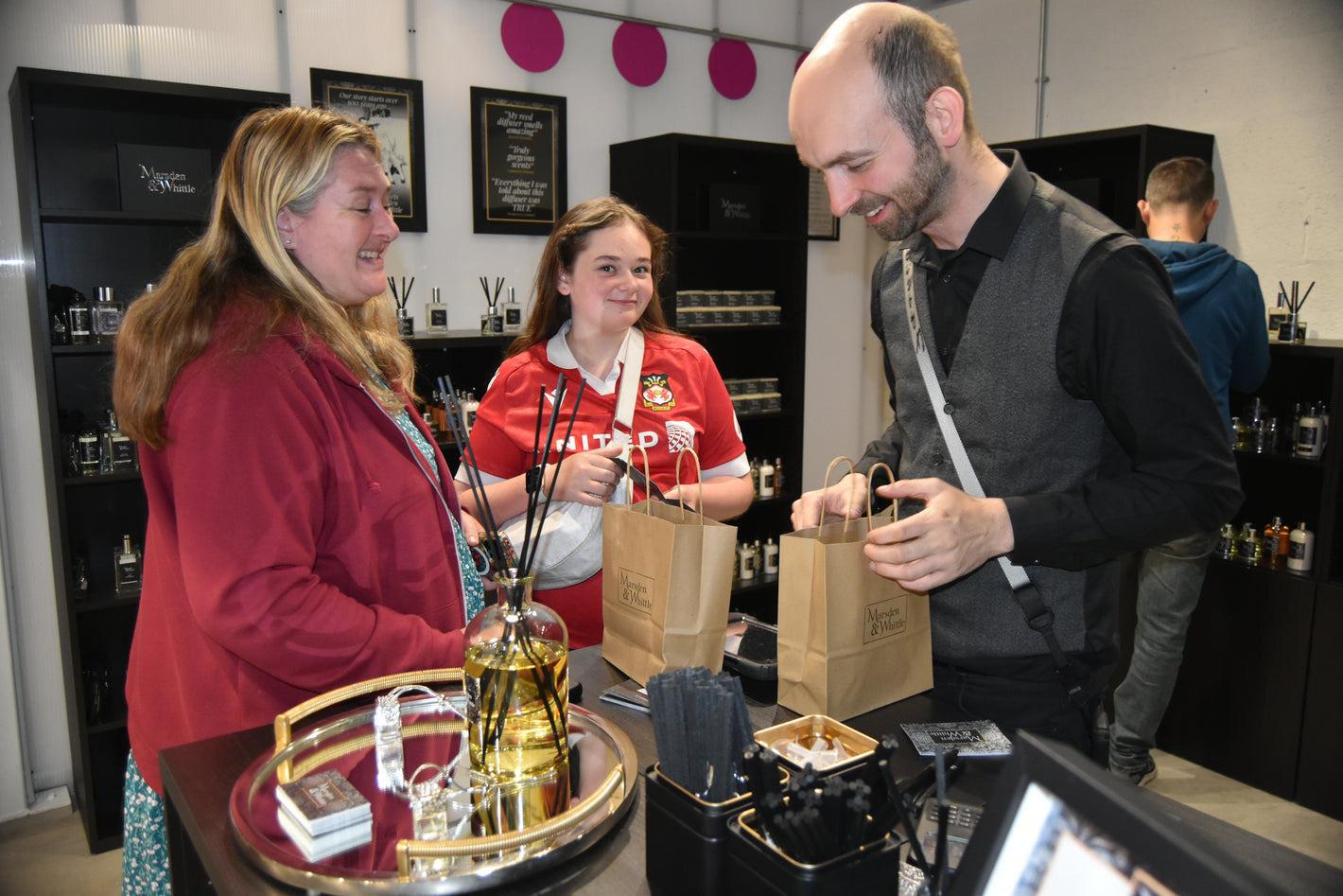Customers being served at the Marsden & Whittle home fragrance stop inside Chapter Court at Wrexham City Centre.