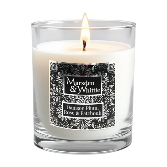 Damson Plum, Rose & Patchouli Candle in a clear glass jar