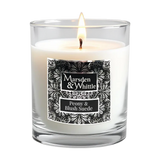 Peony & Blush Suede Candle in a clear glass jar