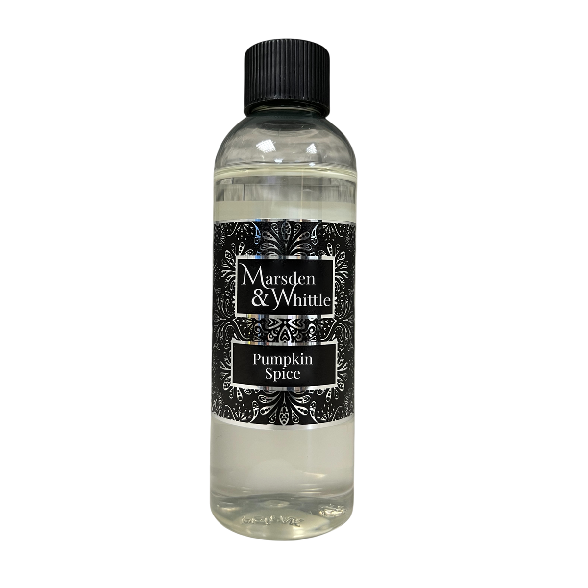 A clear plastic bottle of Marsden & Whittle Pumpkin Spice fragrance oil with a black cap and a black label featuring white text and leaf patterns.